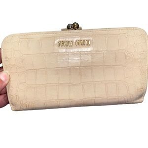Authentic Miu Miu crocodile clasp wallet.